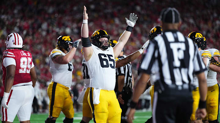 Oct 11, 2025; Madison, Wisconsin, USA; Iowa Hawkeyes offensive lineman Logan Jones (65) celebrates a touchdown in the first half against the Wisconsin Badgers at Camp Randall Stadium. Mandatory Credit: Ross Harried-Imagn Images
