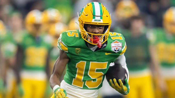 Jan 1, 2024; Glendale, AZ, USA; Oregon Ducks wide receiver Tez Johnson (15) against the Liberty Flames during the 2024 Fiesta Bowl at State Farm Stadium. Mandatory Credit: Mark J. Rebilas-USA TODAY Sports