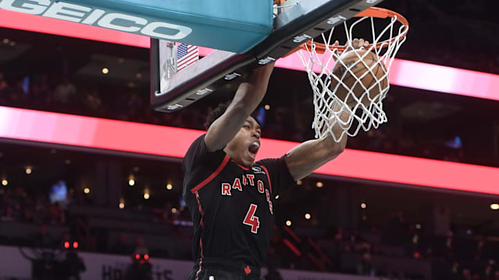 Feb 7, 2024; Charlotte, North Carolina, USA;  Toronto Raptors forward Scottie Barnes (4) dunks
