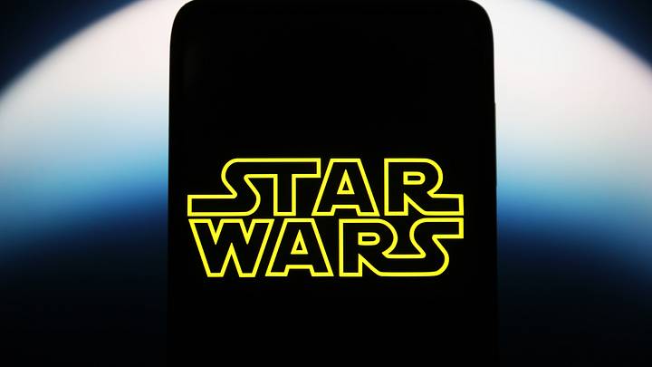 UKRAINE - 2023/05/13: In this photo illustration, a Star Wars logo is seen on a smartphone screen. 