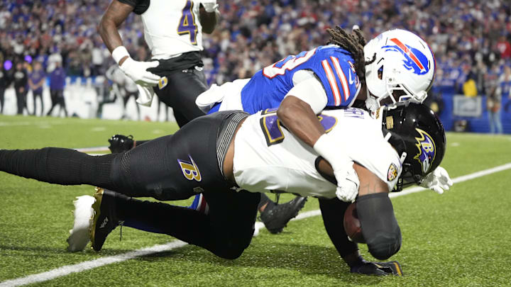 Sep 7, 2025; Orchard Park, New York, USA; Baltimore Ravens running back Derrick Henry (22) runs the ball during the second quarter against Buffalo Bills cornerback Dorian Strong (43) at Highmark Stadium. Sep 7, 2025; Orchard Park, New York, USA; Baltimore Ravens running back Derrick Henry (22) runs the ball during the second quarter against Buffalo Bills cornerback Dorian Strong (43) at Highmark Stadium.