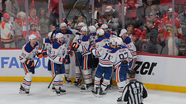 Jun 12, 2025; Sunrise, Florida, USA; Edmonton Oilers celebrate the win in overtime against the Florida Panthers in game four of the 2025 Stanley Cup Final at Amerant Bank Arena. Mandatory Credit: Jim Rassol-Imagn Images