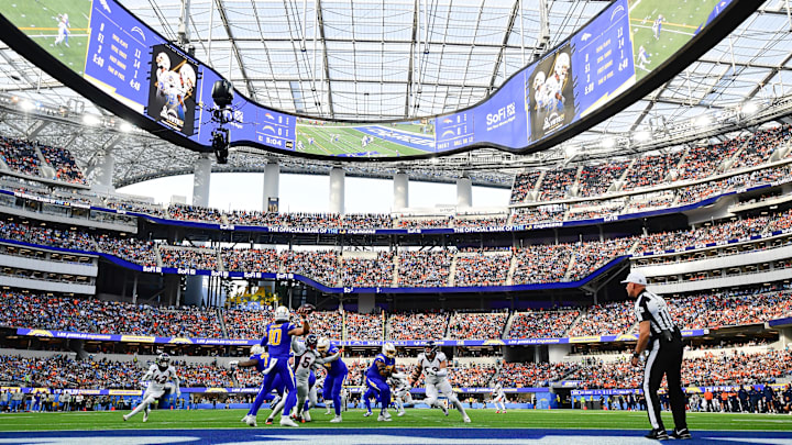 Dec 10, 2023; Inglewood, California, USA; Los Angeles Chargers quarterback Justin Herbert (10) throws against the Denver Broncos  during the first half at SoFi Stadium. Mandatory Credit: Gary A. Vasquez-USA TODAY Sports