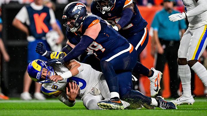 DENVER, CO - SEPTEMBER 27: Los Angeles Rams quarterback Matthew Stafford 9 is tackled by Denver Broncos defensive end Zach Allen 99 after a run in the first quarter during a game between the Los Angeles Rams and the Denver Broncos at Empower Field at Mile High on September 27, 2026 in Denver, Colorado. Photo by Dustin Bradford/Icon Sportswire NFL, American Football Herren, USA SEP 27 Rams at Broncos EDITORIAL USE ONLY Icon132260927009