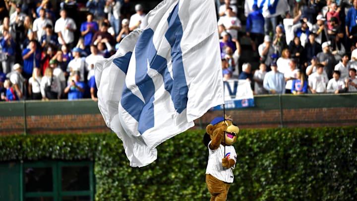 Aug 20, 2024; Chicago, Illinois, USA; Chicago Cubs Clark the Club runs with the W flag after the Chicago Cubs defeat the Detroit Tigers at Wrigley Field. Mandatory Credit: Patrick Gorski-Imagn Images Aug 20, 2024; Chicago, Illinois, USA; Chicago Cubs Clark the Club runs with the W flag after the Chicago Cubs defeat the Detroit Tigers at Wrigley Field. Mandatory Credit: Patrick Gorski-Imagn Images