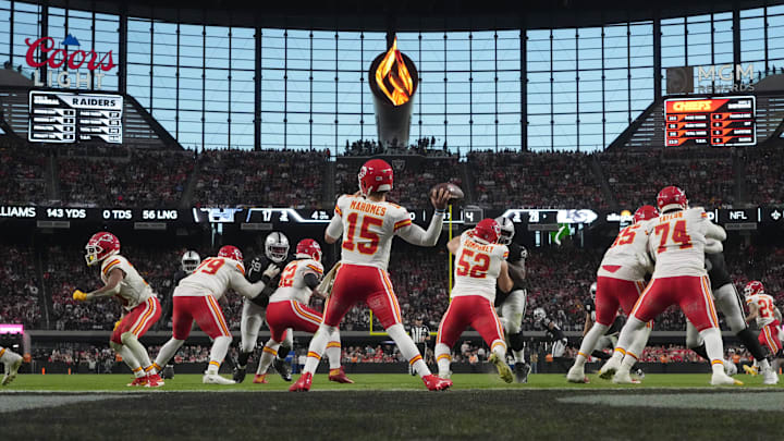 Nov 26, 2023; Paradise, Nevada, USA; Kansas City Chiefs quarterback Patrick Mahomes (15) throws the ball against the Las Vegas Raiders in the second half at Allegiant Stadium. Mandatory Credit: Kirby Lee-Imagn Images