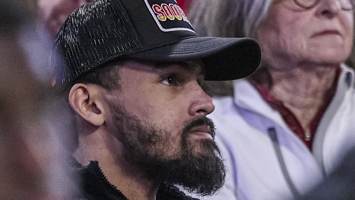 Trae Young #11 of the Atlanta Hawks watches a game between the Oklahoma Sooners and Georgia Bulldogs.