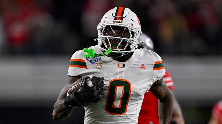 Dec 31, 2025; Arlington, TX, USA; Miami Hurricanes defensive back Keionte Scott (0) returns an interception for a touchdown during the 2025 Cotton Bowl and quarterfinal game of the College Football Playoff at AT&T Stadium. Mandatory Credit: Jerome Miron-Imagn Images Dec 31, 2025; Arlington, TX, USA; Miami Hurricanes defensive back Keionte Scott (0) returns an interception for a touchdown during the 2025 Cotton Bowl and quarterfinal game of the College Football Playoff at AT&T Stadium. Mandatory Credit: Jerome Miron-Imagn Images