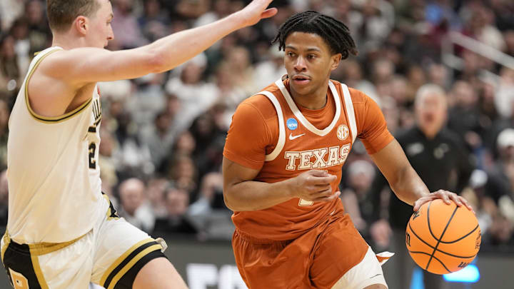Mar 26, 2026; San Jose, CA, USA; Texas Longhorns guard Simeon Wilcher (7) goes to the basket against Purdue Boilermakers guard Fletcher Loyer (2) in the second half during a Sweet Sixteen game of the West Regional of the men's 2026 NCAA Tournament at SAP Center. Credit: Kyle Terada-Imagn Images