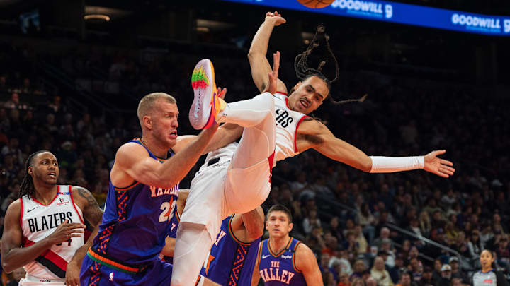 Dec 15, 2024; Phoenix, Arizona, USA; Portland Trail Blazers guard Dalano Banton (5) reacts after colliding with Phoenix Suns center Mason Plumlee (22) in the second half during a game at Footprint Center. Mandatory Credit: Allan Henry-Imagn Images