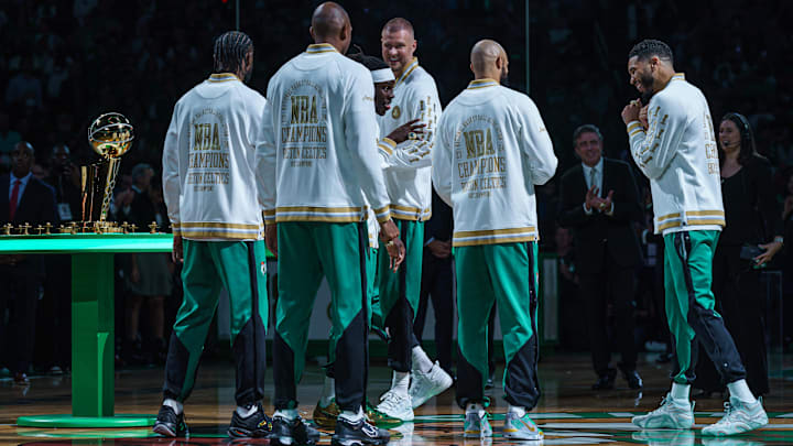 Oct 22, 2024; Boston, Massachusetts, USA; Boston Celtics forward Jayson Tatum (0) is presented with a championship ring during the opening night banner raising ceremony before the start of the game against the New York Knicks at TD Garden. Mandatory Credit: David Butler II-Imagn Images