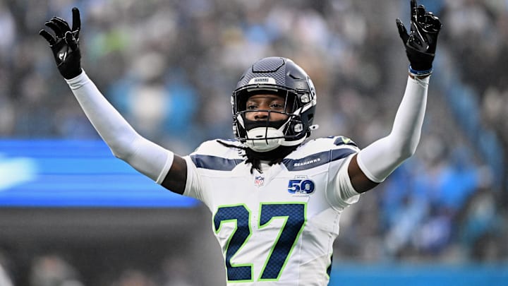 Dec 28, 2025; Charlotte, North Carolina, USA; Seattle Seahawks cornerback Riq Woolen (27) reacts against the Carolina Panthers during the second quarter at Bank of America Stadium. Mandatory Credit: Bob Donnan-Imagn Images