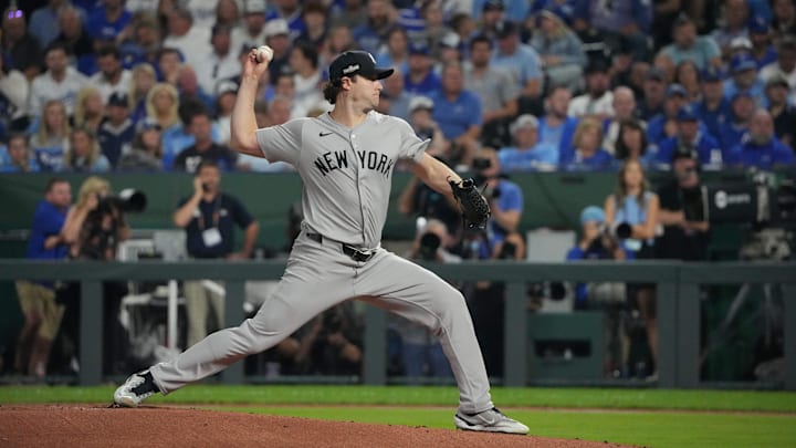 Oct 10, 2024; Kansas City, Missouri, USA; New York Yankees pitcher Gerrit Cole (45) throws a pitch during the first inning against the Kansas City Royals during game four of the ALDS for the 2024 MLB Playoffs at Kauffman Stadium. Mandatory Credit: Denny Medley-Imagn Images
