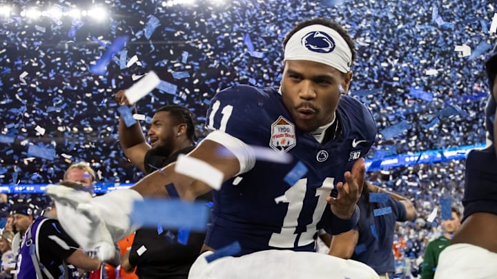 Penn State Nittany Lions defensive end Abdul Carter (11) celebrates with the Heisman pose after defeating the Boise State Broncos in the Fiesta Bowl at State Farm Stadium.