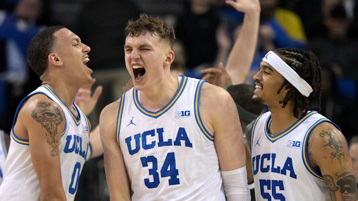 Feb 4, 2025; Los Angeles, California, USA; UCLA Bruins guard Kobe Johnson (0) and guard Skyy Clark (55) celebrate with forward Tyler Bilodeau (34) after a basket during the second half against the Michigan State Spartans at Pauley Pavilion presented by Wescom. Mandatory Credit: Jayne Kamin-Oncea-Imagn Images Feb 4, 2025; Los Angeles, California, USA; UCLA Bruins guard Kobe Johnson (0) and guard Skyy Clark (55) celebrate with forward Tyler Bilodeau (34) after a basket during the second half against the Michigan State Spartans at Pauley Pavilion presented by Wescom. Mandatory Credit: Jayne Kamin-Oncea-Imagn Images