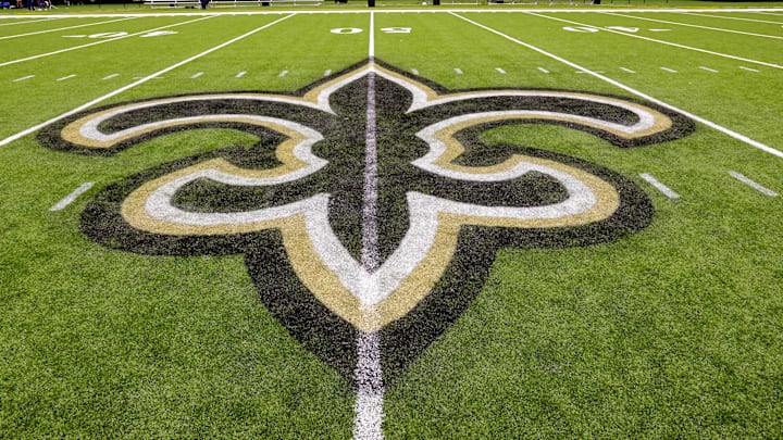 Oct 30, 2022; New Orleans, Louisiana, USA; General view of the New Orleans Saints logo as the midfield logo fleur-de-lis after the game between the New Orleans Saints and the Las Vegas Raiders at Caesars Superdome. Mandatory Credit: Stephen Lew-Imagn Images Oct 30, 2022; New Orleans, Louisiana, USA; General view of the New Orleans Saints logo as the midfield logo fleur-de-lis after the game between the New Orleans Saints and the Las Vegas Raiders at Caesars Superdome. Mandatory Credit: Stephen Lew-Imagn Images