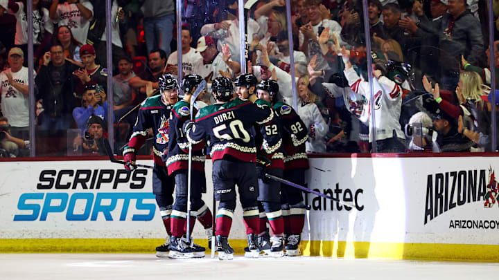 Apr 17, 2024; Tempe, Arizona, USA; The Arizona Coyotes celebrate a goal by left wing Lawson Crouse (67) during the third period against the Edmonton Oilers at Mullett Arena. Mandatory Credit: Mark J. Rebilas-Imagn Images Apr 17, 2024; Tempe, Arizona, USA; The Arizona Coyotes celebrate a goal by left wing Lawson Crouse (67) during the third period against the Edmonton Oilers at Mullett Arena. Mandatory Credit: Mark J. Rebilas-Imagn Images