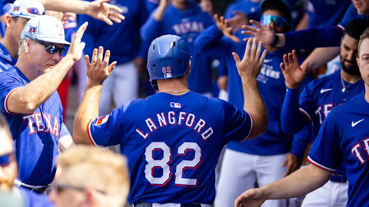 Mar 18, 2024; Surprise, Arizona, USA; Texas Rangers outfielder Wyatt Langford celebrates with