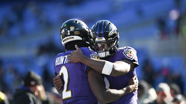 Nov 20, 2022; Baltimore, Maryland, USA;  Baltimore Ravens quarterback Tyler Huntley (2) and quarterback Lamar Jackson (8) hug before the start of the game against the Carolina Panthers at M&T Bank Stadium. Mandatory Credit: Tommy Gilligan-Imagn Images