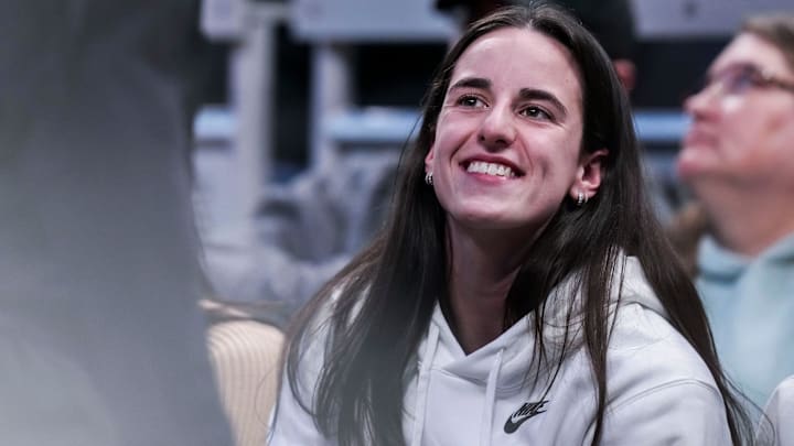 Indiana Fever guard Caitlin Clark (22) smiles Thursday, March 6, 2025, in a round two game at the 2025 TIAA Big Ten Women's Basketball Tournament between the Iowa Hawkeyes and the Michigan State Spartans at Gainbridge Fieldhouse in Indianapolis.