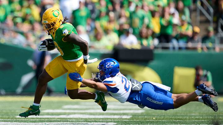 Sep 5, 2026; Eugene, Oregon, USA; Oregon Ducks running back Jordon Davison (0) breaks a tackle during the second half against Boise State Broncos defensive back Roman Tillmon (22) at Autzen Stadium. Mandatory Credit: Troy Wayrynen-Imagn Images