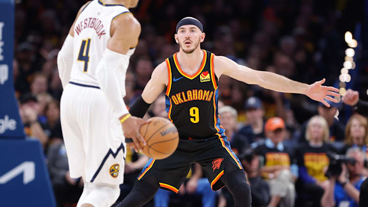 May 5, 2025; Oklahoma City, Oklahoma, USA; Oklahoma City Thunder guard Alex Caruso (9) defends Denver Nuggets guard Russell Westbrook (4) during the second half during game one of the second round for the 2025 NBA Playoffs at Paycom Center. Mandatory Credit: Alonzo Adams-Imagn Images