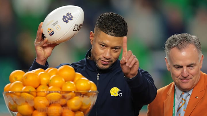 (EDITORS NOTE: caption correction) Jan 9, 2025; Miami, FL, USA; Notre Dame Fighting Irish head coach Marcus Freeman celebrates defeating the Penn State Nittany Lions in the Orange Bowl at Hard Rock Stadium. Mandatory Credit: Sam Navarro-Imagn Images (EDITORS NOTE: caption correction) Jan 9, 2025; Miami, FL, USA; Notre Dame Fighting Irish head coach Marcus Freeman celebrates defeating the Penn State Nittany Lions in the Orange Bowl at Hard Rock Stadium. Mandatory Credit: Sam Navarro-Imagn Images