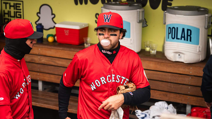 Marcelo Mayer blows a bubble with his gum in the WooSox dugout during a game on April 13, 2025 at Polar Park.