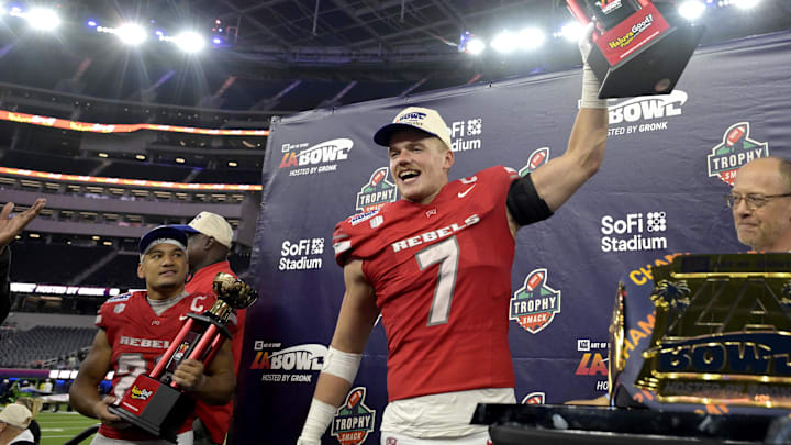 UNLV Rebels linebacker Jackson Woodard (7) holds his defensive player of the game trophy as wide receiver Jacob De Jesus (21) was named offensive player of the game after defeating the California Golden Bears in the LA Bowl at SoFi Stadium. Mandatory Credit: Jayne Kamin-Oncea-Imagn Images UNLV Rebels linebacker Jackson Woodard (7) holds his defensive player of the game trophy as wide receiver Jacob De Jesus (21) was named offensive player of the game after defeating the California Golden Bears in the LA Bowl at SoFi Stadium. Mandatory Credit: Jayne Kamin-Oncea-Imagn Images