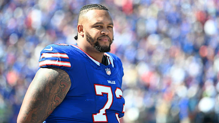 Sep 28, 2025; Orchard Park, New York, USA;  Buffalo Bills offensive tackle Dion Dawkins (73) on the sidelines during the second quarter against the New Orleans Saints at Highmark Stadium.