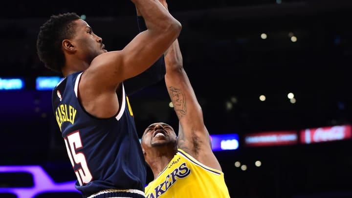 Oct 2, 2018; Los Angeles, CA, USA; Los Angeles Lakers guard Kentavious Caldwell-Pope (1) defends a shot by Denver Nuggets guard Malik Beasley (25) in the first half at Staples Center. Mandatory Credit: Jayne Kamin-Oncea-USA TODAY Sports