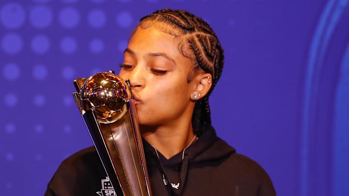 Washington Spirit's Croix Bethune kisses her trophy for Midfielder of the Year during media day ahead of the 2024 NWSL Championship match. 