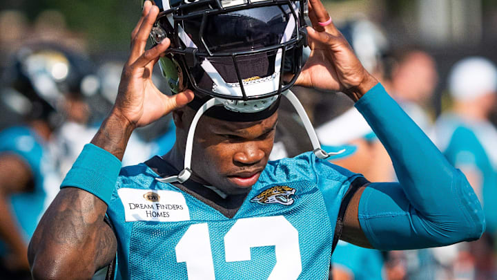 Jacksonville Jaguars wide receiver Travis Hunter (12) takes his helmet off during the seventh organized team activity at the Miller Electric Center in Jacksonville, Fla. Monday, June 2, 2025. [Doug Engle/Florida Times-Union]