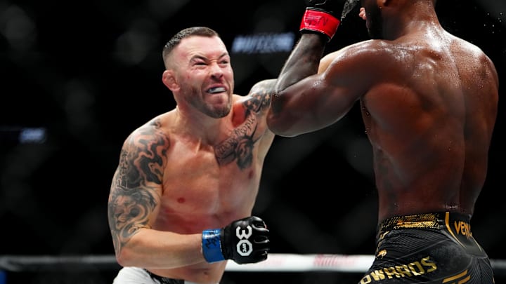 Dec 16, 2023; Las Vegas, Nevada, USA; Leon Edwards (red gloves) fights Colby Covington (blue gloves) during UFC 296 at T-Mobile Arena. Mandatory Credit: Stephen R. Sylvanie-Imagn Images