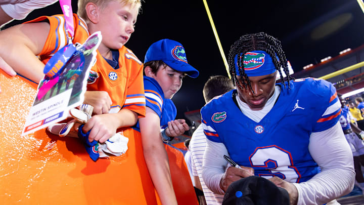 Florida Gators defensive back Jason Marshall Jr. (3) signs autographs for fans after a win over UCF. Florida Gators defensive back Jason Marshall Jr. (3) signs autographs for fans after a win over UCF.