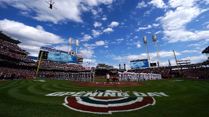 Military helicopters perform a flyover as the national anthem concludes before a baseball game Military helicopters perform a flyover as the national anthem concludes before a baseball game