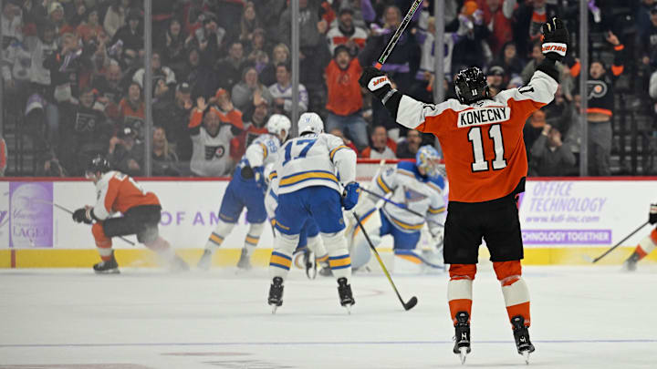 Nov 20, 2025; Philadelphia, Pennsylvania, USA; Philadelphia Flyers right wing Travis Konecny (11) celebrates game-winning goal in overtime by Philadelphia Flyers defenseman Travis Sanheim (6) against the St. Louis Blues at Xfinity Mobile Arena. Mandatory Credit: Eric Hartline-Imagn Images