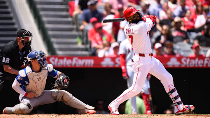 Apr 22, 2026; Anaheim, California, USA; Los Angeles Angels left fielder Jo Adell (7) hits a sacrifice fly for an RBI during the third inning against the Toronto Blue Jays at Angel Stadium. Mandatory Credit: William Liang-Imagn Images