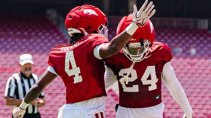 Arkansas Razorback defensive backs La'Khi Roland and Miguel Mitchell celebrate following a play in scrimmage one of fall camp. Arkansas Razorback defensive backs La'Khi Roland and Miguel Mitchell celebrate following a play in scrimmage one of fall camp.
