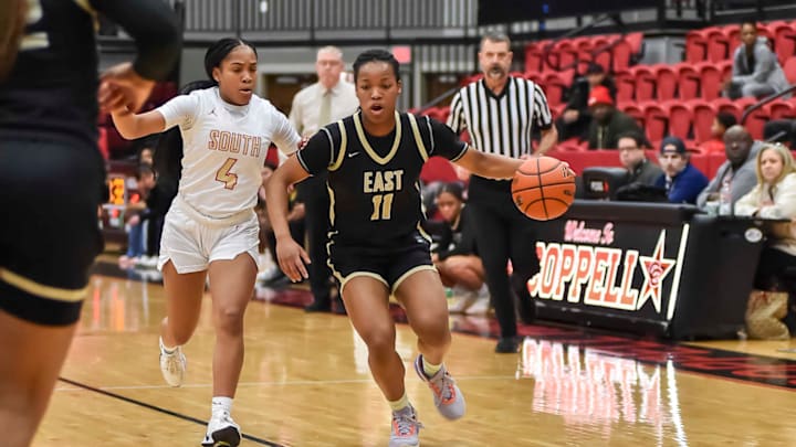 Plano East freshman guard Arianna Robinson (11) dribbles during a Feb. 14 game against South Grand Prairie. 
