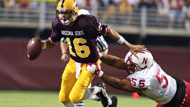 Arizona State quarterback Jake Plummer eludes Nebraska defensive tackle Jason Peter during the Sun Devils' 19-0 win on Sept. 21, 1996, in Tempe. Arizona State quarterback Jake Plummer eludes Nebraska defensive tackle Jason Peter during the Sun Devils' 19-0 win on Sept. 21, 1996, in Tempe.