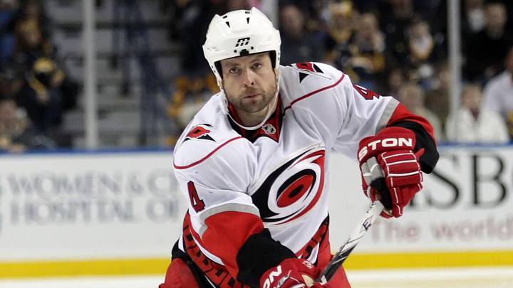 Feb 5, 2010; Buffalo, NY, USA; Carolina Hurricanes defenseman Aaron Ward (4) shoots the puck into the Buffalo Sabres zone in the first period at HSBC Arena. Mandatory Credit: Kevin Hoffman-Imagn Images Feb 5, 2010; Buffalo, NY, USA; Carolina Hurricanes defenseman Aaron Ward (4) shoots the puck into the Buffalo Sabres zone in the first period at HSBC Arena. Mandatory Credit: Kevin Hoffman-Imagn Images