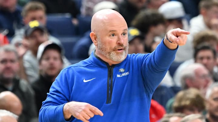 Mar 19, 2026; Buffalo, NY, USA; Saint Louis Billikens head coach Josh Schertz instructs his team against the Georgia Bulldogs during the first half of a first round game of the men's 2026 NCAA Tournament at Keybank Center. Mar 19, 2026; Buffalo, NY, USA; Saint Louis Billikens head coach Josh Schertz instructs his team against the Georgia Bulldogs during the first half of a first round game of the men's 2026 NCAA Tournament at Keybank Center.