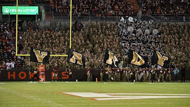 Sep 6, 2025; Blacksburg, Virginia, USA; Vanderbilt Commodores cheerleader carry their flags across the end zone after scoring a touchdown during the fourth quarter at Lane Stadium. Mandatory Credit: Brian Bishop-Imagn Images Sep 6, 2025; Blacksburg, Virginia, USA; Vanderbilt Commodores cheerleader carry their flags across the end zone after scoring a touchdown during the fourth quarter at Lane Stadium. Mandatory Credit: Brian Bishop-Imagn Images