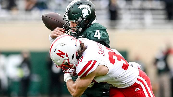 Michigan State quarterback Sam Leavitt is hit by Nebraska's Phalen Sanford during the Huskers' most recent visit to East Lansing, in 2023. Michigan State quarterback Sam Leavitt is hit by Nebraska's Phalen Sanford during the Huskers' most recent visit to East Lansing, in 2023.