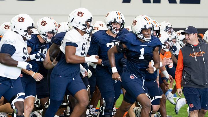 Auburn Tigers players break a huddle during Auburn football practice at Woltosz Football Performance Center. Auburn Tigers players break a huddle during Auburn football practice at Woltosz Football Performance Center.