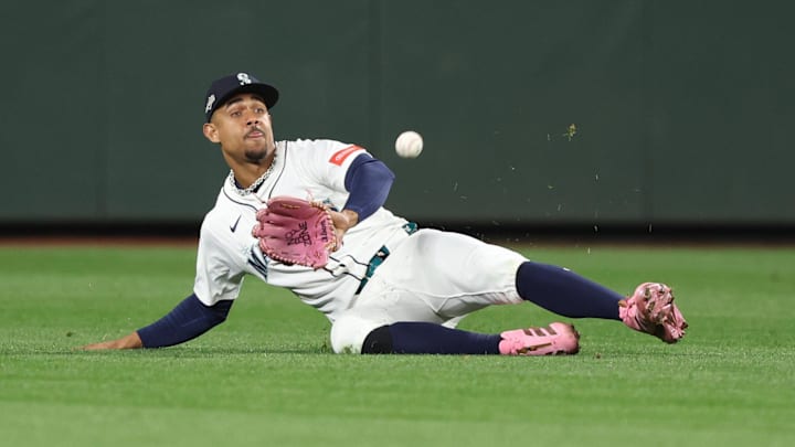 Oct 16, 2025; Seattle, Washington, USA; Seattle Mariners center fielder Julio Rodriguez (44) makes a catch in the ninth inning against the Toronto Blue Jays during game four of the ALCS round for the 2025 MLB playoffs at T-Mobile Park. Mandatory Credit: Kevin Ng-Imagn Images