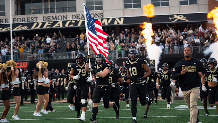Wake Forest Demon Deacons take the field as they prepare to battle the UNC Tar Heels 