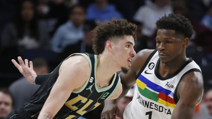 Feb 24, 2023; Minneapolis, Minnesota, USA; Charlotte Hornets guard LaMelo Ball (1) works past Minnesota Timberwolves forward Anthony Edwards (1) in the third quarter at Target Center. Mandatory Credit: Bruce Kluckhohn-Imagn Images