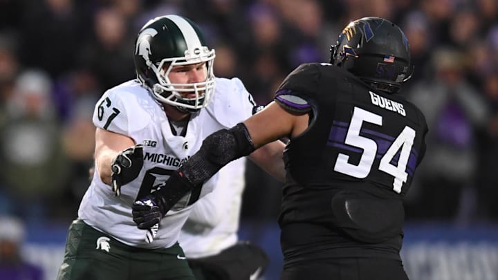 Oct 28, 2017; Evanston, IL, USA; Michigan State Spartans offensive tackle Cole Chewins (61) in action against the Northwestern Wildcats during a game at Ryan Field. Mandatory Credit: Patrick Gorski-Imagn Images